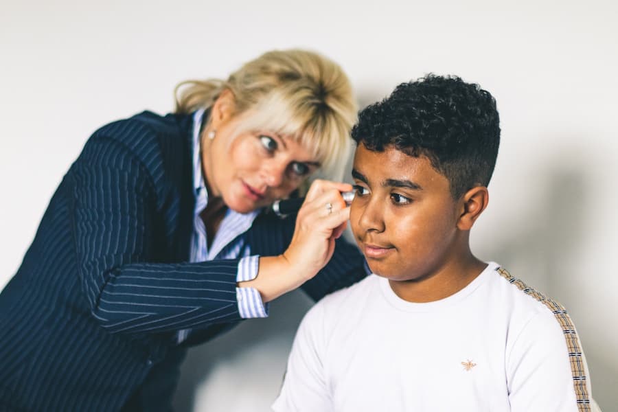 Marina Examnining A Boy's Ears